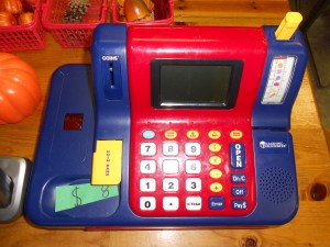 Bring your money to buy some pumpkins! We made our own dollars. It was a good numeral writing practice for us.